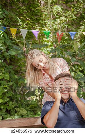 Woman giving to her boyfriend a surprise View Large Photo Image Stock Photography - Woman giving to her boyfriend a surprise. Fotosearch
