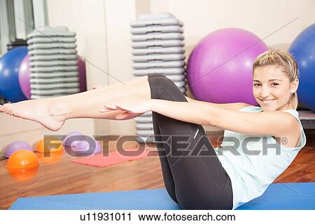 Stock Image - Woman making yoga. Fotosearch
