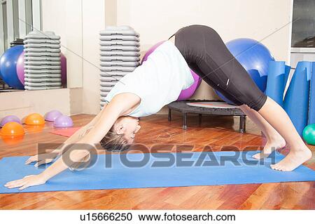 Stock Image - Woman making yoga. Fotosearch