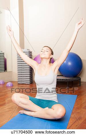 Stock Image - Woman making yoga. Fotosearch