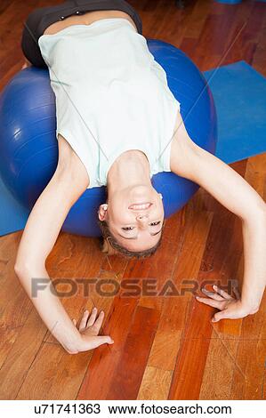 Woman making yoga View Large Photo Image Stock Image - Woman making yoga. Fotosearch