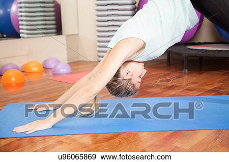 Stock Photo - Woman making yoga. Fotosearch