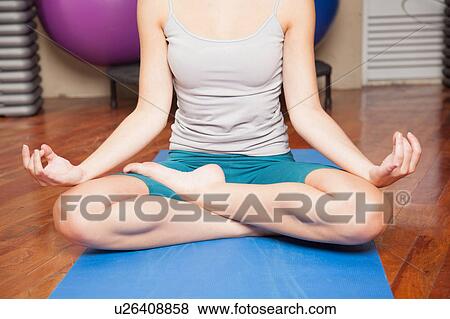 Stock Photo - Woman meditating. Fotosearch