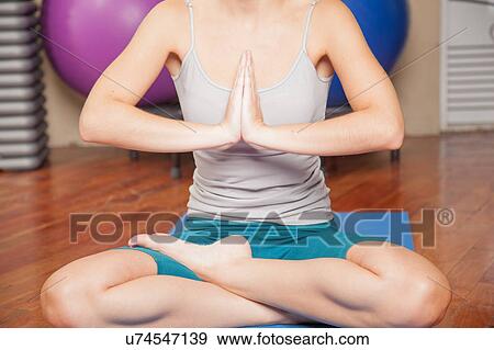 Woman meditating View Large Photo Image Stock Photo - Woman meditating. Fotosearch