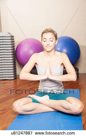 Stock Photo - Woman meditating. Fotosearch