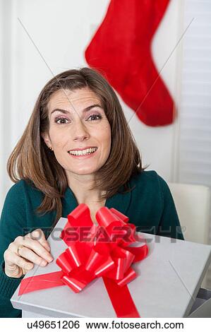 Woman opening her surprise View Large Photo Image Stock Photograph - Woman opening her surprise. Fotosearch