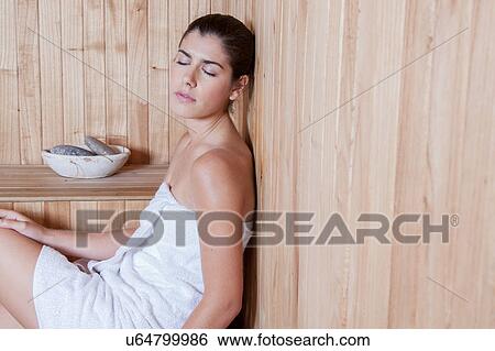 Stock Photograph - Woman resting in the sauna. Fotosearch