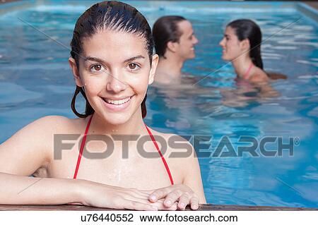 Woman smiling in the pool View Large Photo Image Stock Image - Woman smiling in the pool. Fotosearch