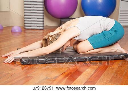 Woman stretching View Large Photo Image Stock Image - Woman stretching. Fotosearch