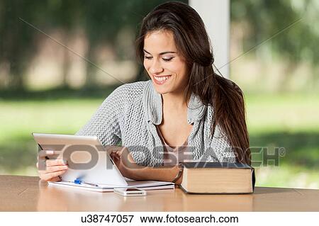 Stock Photo - Woman studying. Fotosearch