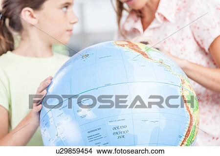 Picture - woman teaching geography.. Fotosearch