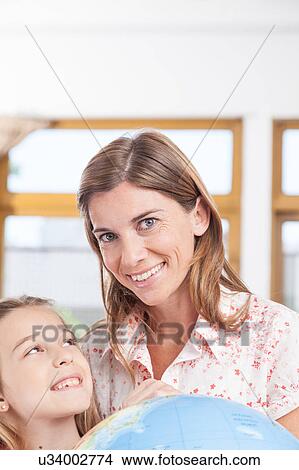 Picture - woman teaching geography.. Fotosearch