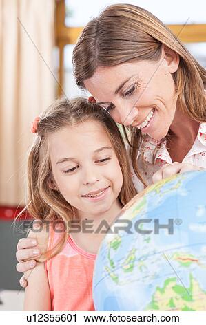 Stock Image - woman teaching geography.. Fotosearch