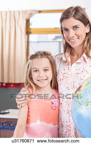 Stock Image - woman teaching geography.. Fotosearch