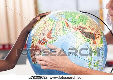 Stock Image - woman teaching geography.. Fotosearch