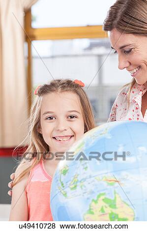 Stock Photo - woman teaching geography.. Fotosearch