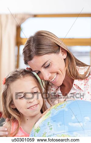 Stock Photo - woman teaching geography.. Fotosearch