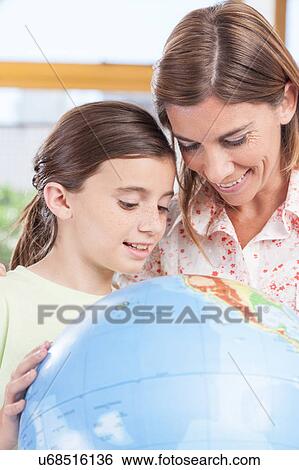 Stock Photograph - woman teaching geography.. Fotosearch
