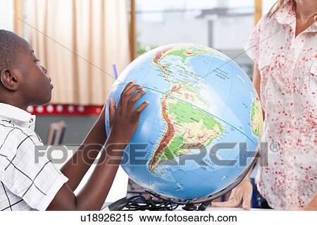 Stock Photography - woman teaching geography.. Fotosearch