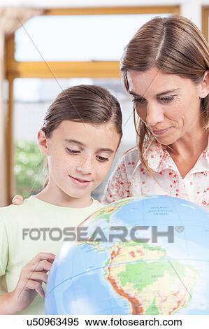 Stock Photography - woman teaching geography.. Fotosearch