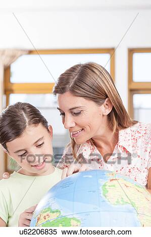 Stock Photography - woman teaching geography.. Fotosearch