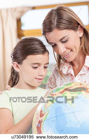 Stock Photography - woman teaching geography.. Fotosearch