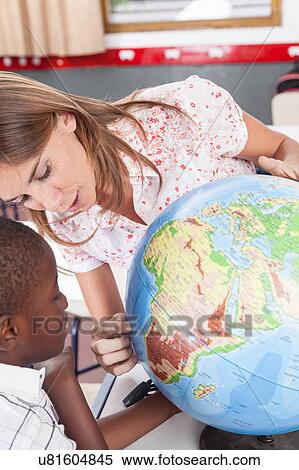 Stock Photography - woman teaching geography.. Fotosearch
