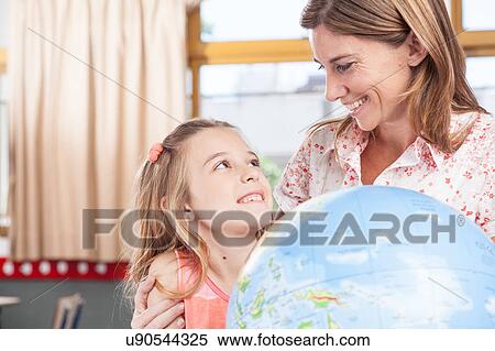 Stock Photography - woman teaching geography.. Fotosearch