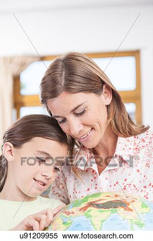 Stock Photography - woman teaching geography.. Fotosearch