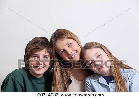 Stock Image - Woman with your two childrens. Fotosearch