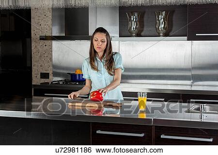 Stock Photograph - Women cooking in the kitchen. Fotosearch
