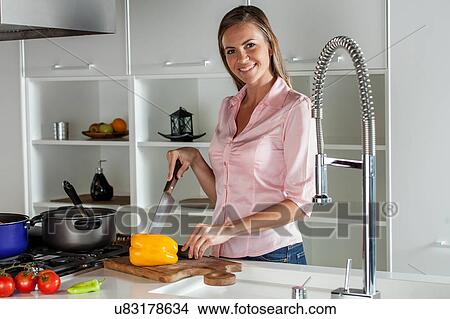 women cutting a vegetable View Large Photo Image Picture - women cutting a vegetable. Fotosearch