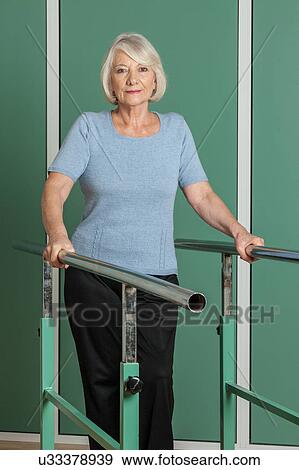 Stock Photo - Women rehabilitating her legs. Fotosearch