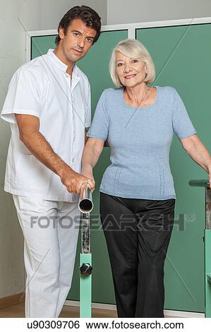Stock Photograph - Women rehabilitating her legs. Fotosearch