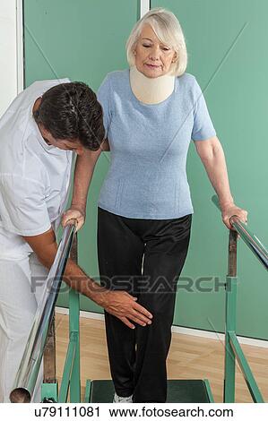 women rehabilitating her legs with his doctor View Large Photo Image Stock Image - women rehabilitating her legs with his doctor. Fotosearch