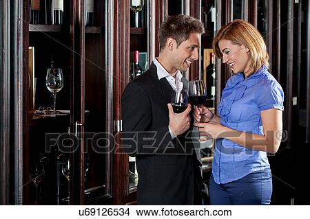 Young couple in love making a toast View Large Photo Image Picture - Young couple in love making a toast. Fotosearch