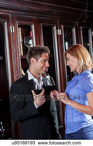 Young couple in love making a toast View Large Photo Image Stock Image - Young couple in love making a toast. Fotosearch