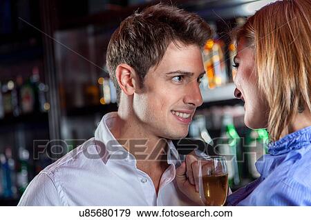 Young couple in love making a toast View Large Photo Image Stock Photo - Young couple in love making a toast. Fotosearch