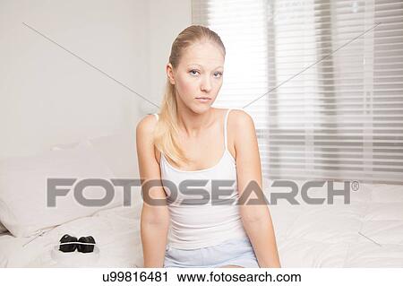 Young woman looking at camera View Large Photo Image Stock Image - Young woman looking at camera. Fotosearch