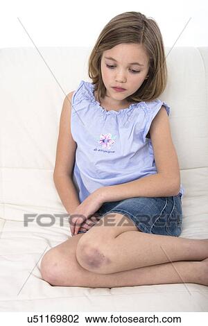 Girl with a bruised knee. View Large Photo Image Stock Image - Girl with a bruised knee.. Fotosearch