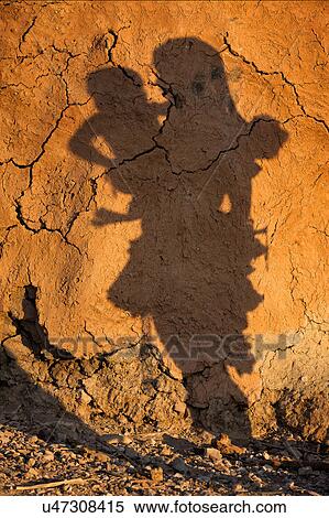 Himba mother and baby shadows View Large Photo Image Stock Photography - Himba mother and baby shadows. Fotosearch
