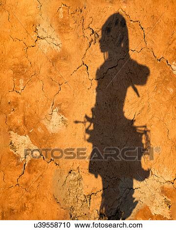 Stock Image - Himba shadow at sunset. Fotosearch