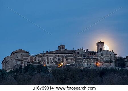 Picture - Moon setting over MonteCastello di Vibio. Fotosearch
