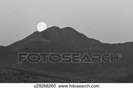 Stock Image - Moonset over Mount Snowdon 3. Fotosearch