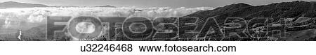 Stock Photo - Morning Umbrian fog over hlll top Umbrian town, Italy. Fotosearch