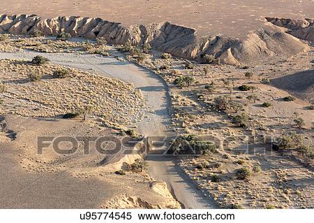 Stock Photography - River carvings in the sand. Fotosearch