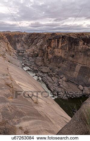 Rocky river gorge at first light View Large Photo Image Picture - Rocky river gorge at first light. Fotosearch