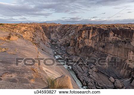 Rocky river gorge at first light View Large Photo Image Stock Photo - Rocky river gorge at first light. Fotosearch