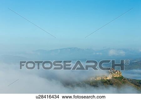 Picture - Sicily in springtime: Easter Culture, beaches, snow covered mountains, central landscapes, architecture shaped by the centuries, Italy. Fotosearch