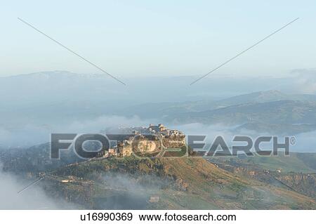Stock Photo - Sicily in springtime: Easter Culture, beaches, snow covered mountains, central landscapes, architecture shaped by the centuries, Italy. Fotosearch